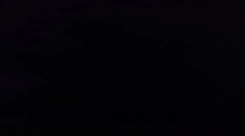 Cloud-to-cloud lightning scribbles illuminating black sky over prairie Stock Footage 59526320