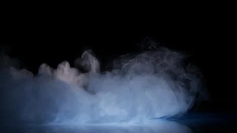 Cloud of cold fog in blue light spot on black background Stock Footage 90543836