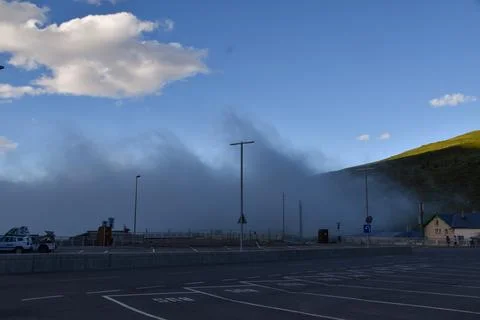 Cloud coming up the mountain and into Pas de la Casa in Andorra 写真素材