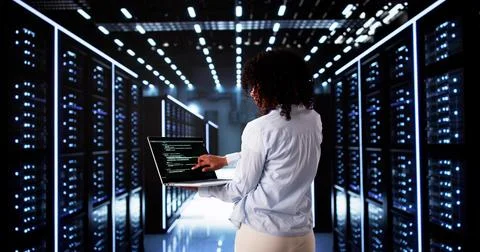 Cloud Computer Engineer Coding In Server Room In Data Center 写真素材