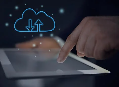 Cloud computing and storage concept. Man using tablet on dark background, clo 스톡 사진