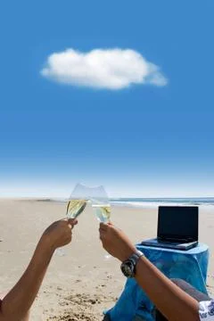 Cloud computing: celebration at beach Stock Photos