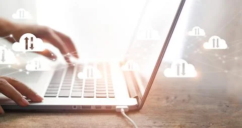 Cloud computing concept, Businessman using laptop with white clouds computing Fotos Stock