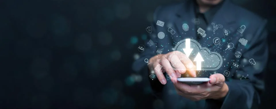 Cloud computing concept. A businessman using cloud computing service throug.. Stock Photos