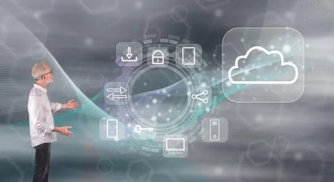 A cloud computing concept explained by a businessman on a wall screen Stock Photos