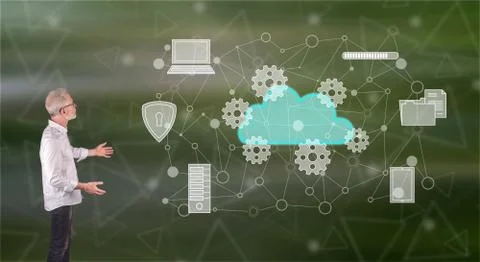 A cloud computing concept explained by a businessman on a wall screen Stock Photos