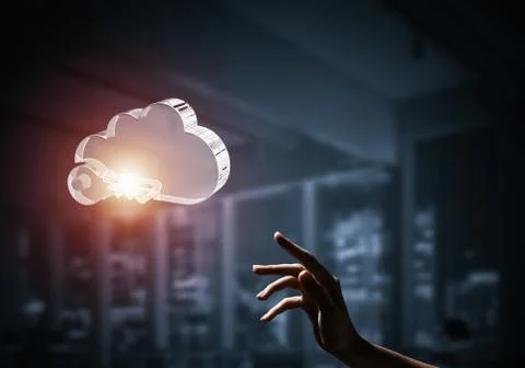 Cloud computing concept with glass symbol shown in hand. Mixed m Foto stock