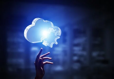 Cloud computing concept with glass symbol shown in hand. Mixed media Foto stock