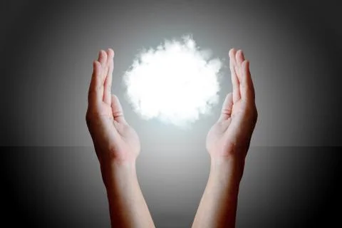 Cloud computing concept, Man hand holding cloud and protection between hand. Stock Photos