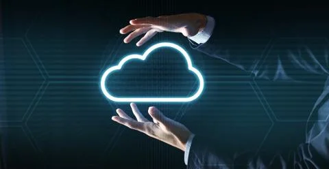 Cloud computing concept. Unrecognizable businessman in suit holding cloud icon Stock Photos