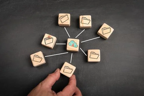 Cloud computing concept. Wooden blocks on a dark chalkboard background Stockfoto's