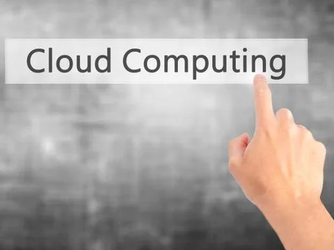 Cloud Computing - Hand pressing a button on blurred background concept on vis Stock Photos