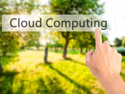 Cloud Computing - Hand pressing a button on blurred background concept on vis Stock Photos