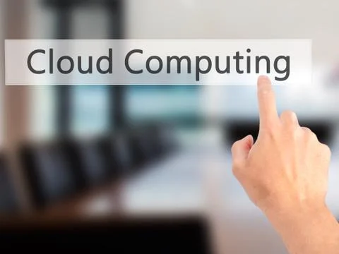 Cloud Computing - Hand pressing a button on blurred background concept on vis Stock Photos