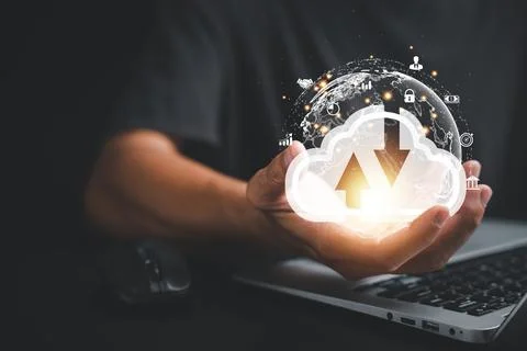 The cloud computing icon rests in the hand of a visionary businessman Foto stock