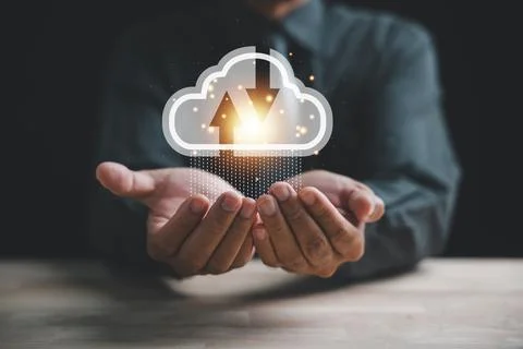 The cloud computing icon rests in the hand of a visionary businessman Foto stock