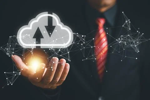 The cloud computing icon rests in the hand of a visionary businessman Foto stock