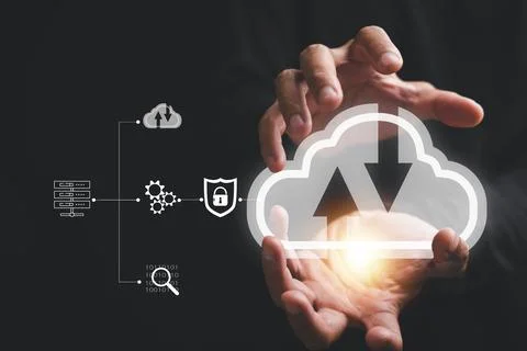 The cloud computing icon rests in the hand of a visionary businessman Stock Photos