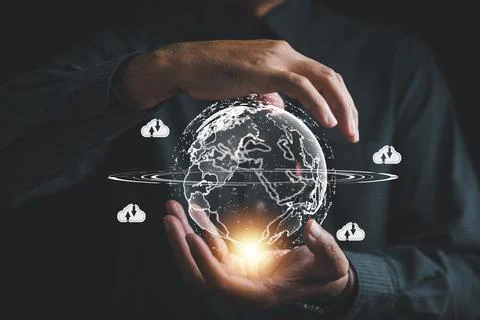 The cloud computing icon rests in the hand of a visionary businessman Foto stock