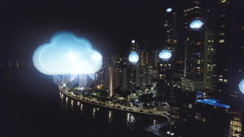 Cloud computing icons data moving on a night city skyline - 3d render 動画素材 165430180