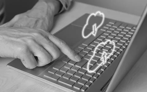 Cloud computing. Man using laptop for download files from online storage Stock Photos