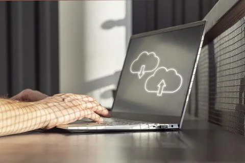 Cloud computing. Man using laptop for upload, storage, download or sharing files Foto stock