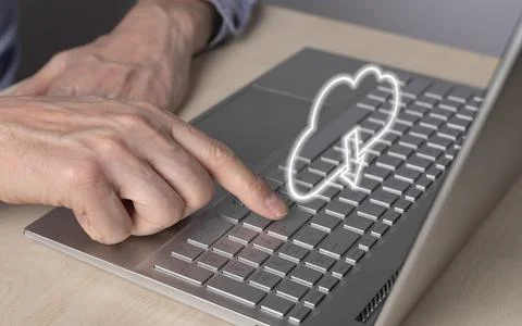 Cloud computing. Man using laptop for retrieving files from online storage Foto stock