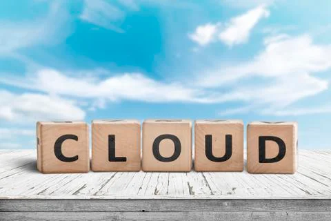 Cloud computing sign on a table with white clouds Stock Photos