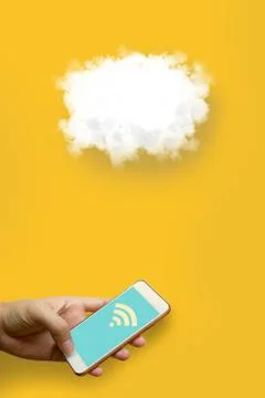 Cloud computing technology concept, Man holding smart phone and using wifi .. Stock Photos