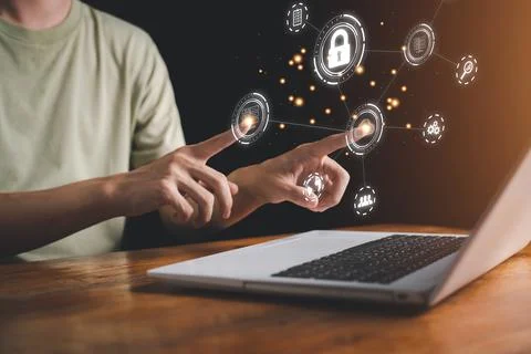 Cloud computing technology concept. Man is touch hologram and using notebook Stock Photos