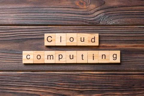 Cloud computing word written on wood block. Cloud computing text on cement ta 写真素材