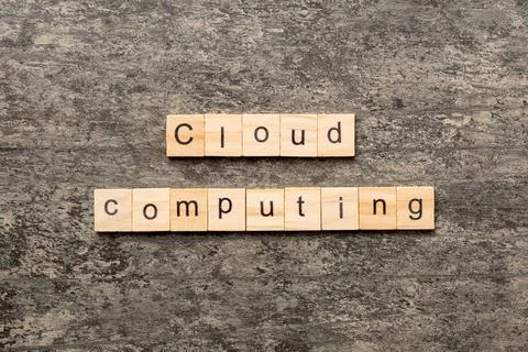 Cloud computing word written on wood block. Cloud computing text on cement ta 스톡 사진