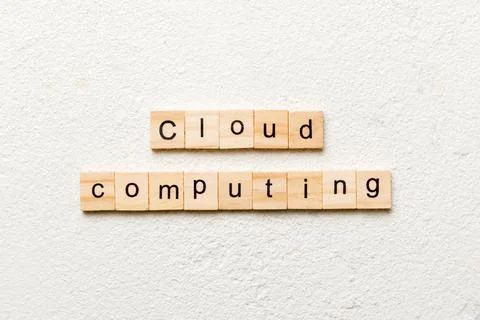Cloud computing word written on wood block. Cloud computing text on cement ta 写真素材