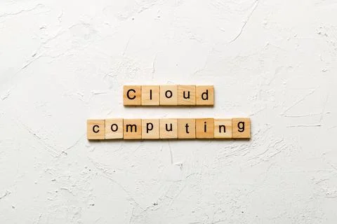 Cloud computing word written on wood block. Cloud computing text on cement ta 스톡 사진