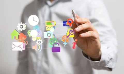 A cloud connected to many objects on a virtual screen. Stock Photos