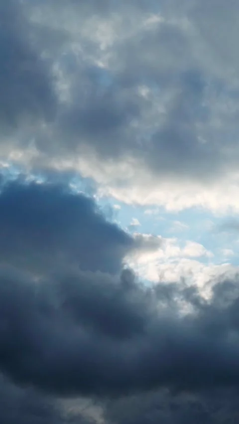 Cloud cover and blue sky breaking through it. Video stock 276876907