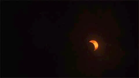 Cloud Covered 40% View of Eclipse. Stock Photos