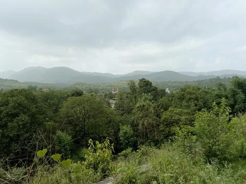 Cloud-covered monsoon sky show the panaromic view of layers of mountain Stock Photos