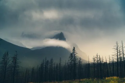 Cloud covered mountain peak. Stock Photos
