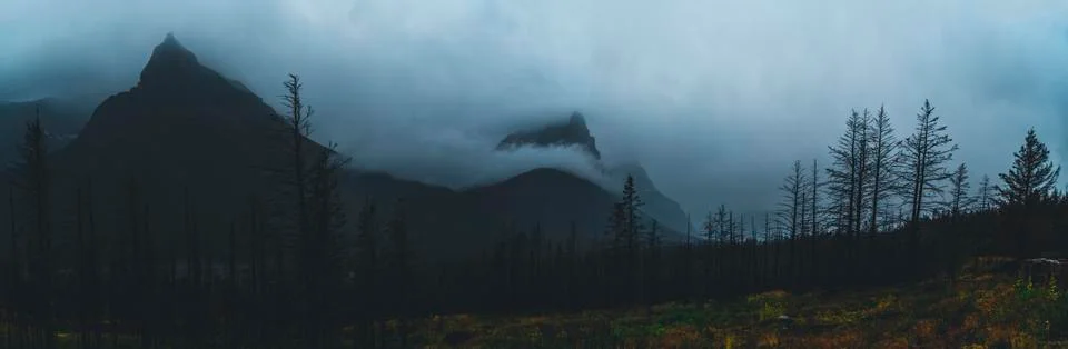 Cloud covered mountain peak. Stock Photos