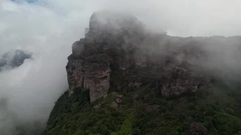 Cloud Covered Mountain Ridge: Dramatic Foggy Landscape with Dense Nature Stockbeeldmateriaal 332726935