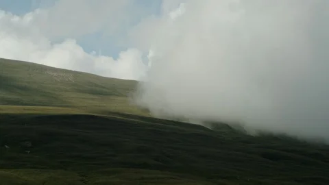 Cloud covers mountain meadows Stock Footage 112734684