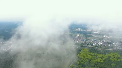 Cloud covers the view from the drone's camera, covering industrial zone of the Stock Footage 113931013
