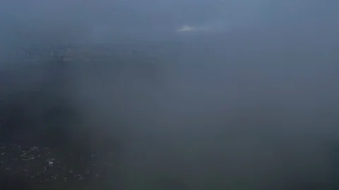 Cloud covers the view from the drone's camera, covering industrial zone of Stock Footage 113931388