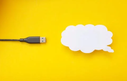 Cloud for data storage cut from paper on a yellow background and cable usb Stock Photos