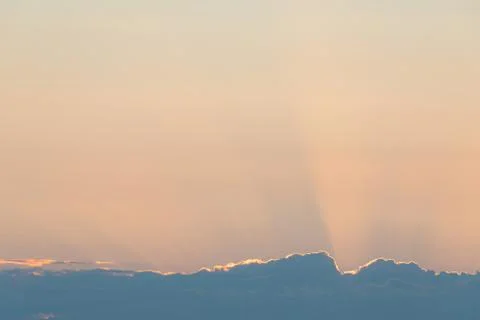 Cloud edge and sunset light behind clouds Stock Photos