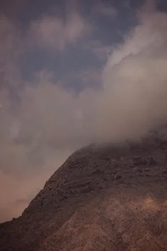Cloud-Enveloped Mountain Peak in Oman Sadah Desert Landscape Stock Photos