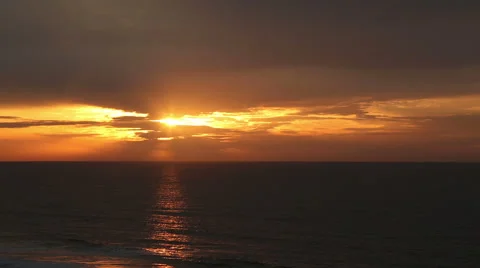 Cloud filtered sunrise over the ocean Stock Footage 49229135