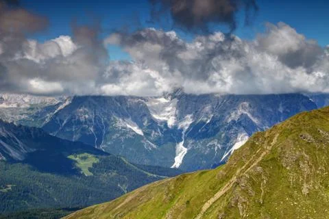 Cloud with flat base covers peaks of Sexten Dolomites, Italy Stock Photos