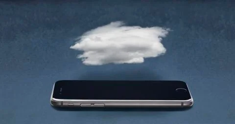 Cloud floating over cell phone Foto stock